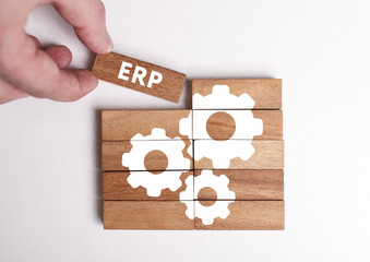 Business, Technology, Internet and network concept. Young businessman shows the word: ERP