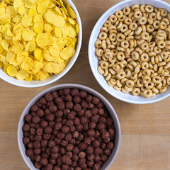 Bowls of cereal on a wooden table top view