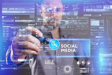 Fototapeta premium Business, Technology, Internet and network concept. Young businessman working on a virtual screen of the future and sees the inscription: Social media