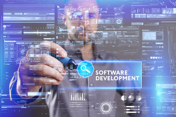 Business, Technology, Internet and network concept. Young businessman working on a virtual screen of the future and sees the inscription: Software development
