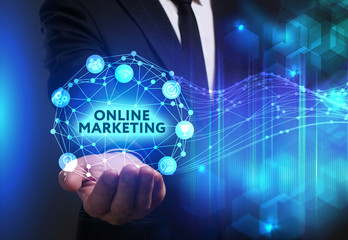 Business, Technology, Internet and network concept. Young businessman working on a virtual screen of the future and sees the inscription: Online marketing