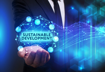 Business, Technology, Internet and network concept. Young businessman working on a virtual screen of the future and sees the inscription: Sustainable development