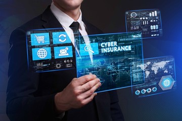 Obraz premium Business, Technology, Internet and network concept. Young businessman working on a virtual screen of the future and sees the inscription: Cyber insurance
