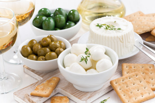 soft cheeses, crackers and pickles for wine
