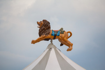Lion over the dome of the carousel in the town square