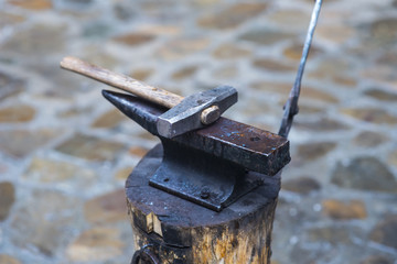 A metal fabricator utilizing a torch to heat up a piece of metal in order to shape it utilizing a forging technique developed over hundred years ago.
