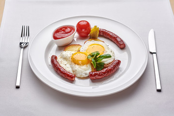 Delicious Omurice omelette with ketchup close-up on a plate. Horizontal