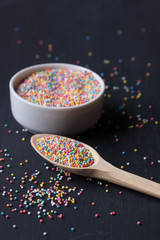 Sugar sprinkles on a black background
