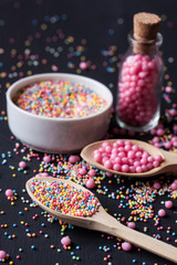 Sugar sprinkles on a black background