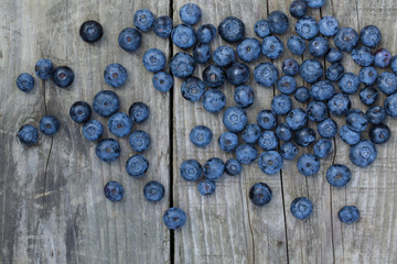 Blueberry on wooden table background. Ripe and juicy fresh picked blueberries closeup. Berries closeup