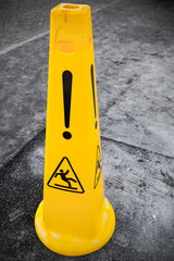 Caution wet floor, yellow warning sign