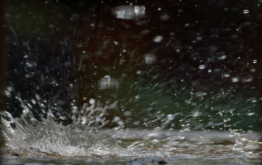 Fototapeta na wymiar rainy season. Water falling on a wall