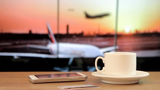 Hot coffee at the airport, gadgets,Take-off plane