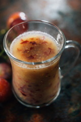 Grape smoothie over black metal board