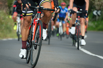 Naklejka na ściany i meble Cycling competition cyclist athletes riding a race on the road