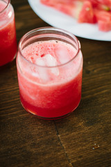Delicious watermelon smoothie on the wooden board. Smoothie - vegetarian coctail from fresh fruit - watermelon