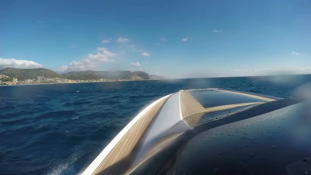 On Board View Of A Boat Navigating Slowly On Choppy Sea.