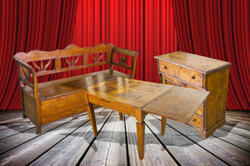 Ladies and gentlemen here is to you the old furniture just restored! - concept image with an old italian furniture on stage