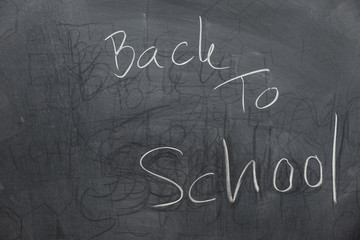 text back to school on blackboard or chalkboard