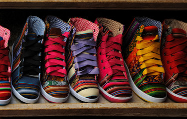 Colorful shoes on a market stool in Lima, Peru - obrazy, fototapety, plakaty