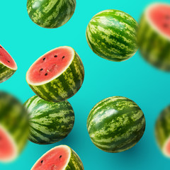 Delicious and juicy sweet watermelons sliced and whole on a summer background.