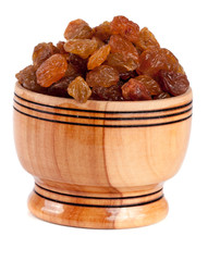 Fototapeta na wymiar raisins in a wooden bowl isolated on white background