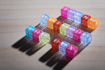 THINK OUTSIDE THE BOX, by colorful alphabet beads