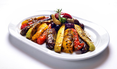 grilled vegetables on white plate with olives