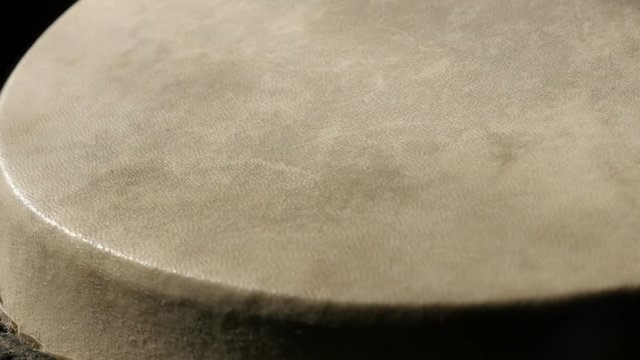 Close-up of old goblet drum details and playing surface slow pan 4K 2160p 30fps UltraHD footage - Panning over fine leather membrane of tribal chalice tarabuka 3840X2160 UHD video 