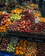 Porto, Portugal. Food market, fruit stalls. Apples, tangerines, maniola, peaches, pineapples, strawberries, mango, avocado, pears.