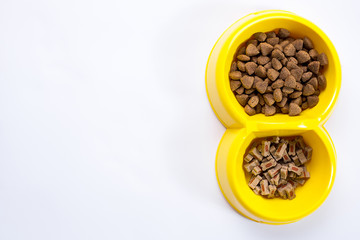 dry pet food in bowl on white background top view