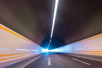 highway tunnel with car driving motion blur