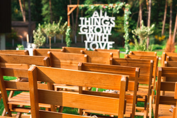 Wedding ceremony arch with flowers and greenery
