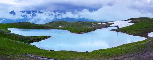 Tuinposter Beatiful high mountain lake with a panoramic view of the sky. © Vitalii_Mamchuk