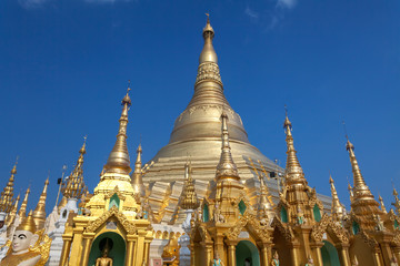 Fototapeta premium Shwedagon Pagoda in daytime with blue sky, the Pagoda is a famous tourist place in Yangon.Myanmar Burma.