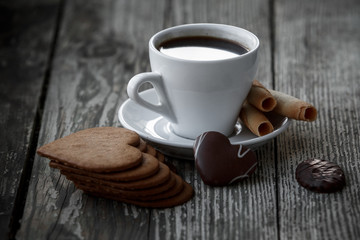 Coffee break, breakfast. Cup of coffee with biscuit cookies