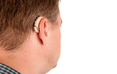 Fototapeta premium Profile of a man wearing hearing aid