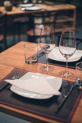 Fototapeta na wymiar Wine glasses in a restaurant setting.