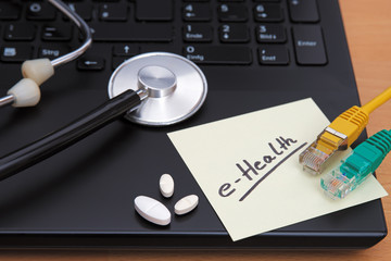 a laptop prepared for a video conference and a stethoscope in a medical practice