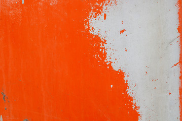 iron surface is covered with orange and grey color remnants of old paint, texture background