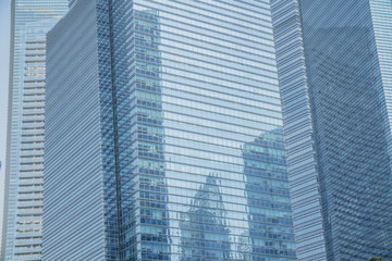 Business Modern architecture close up, texture windows of a high rise building