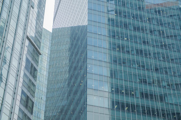 Fototapeta na wymiar Business Modern architecture close up, texture windows of a high rise building