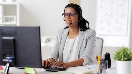 businesswoman with headset and computer at office - Powered by Adobe