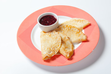 pancakes with jam on a plate.Close up