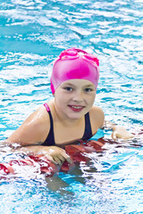 Cute girl in swimming pool