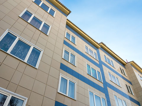 Fragment of a new apartment building with ventilated facade