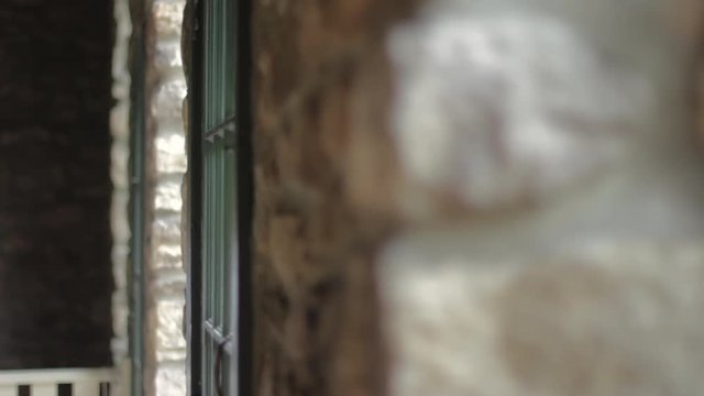 Rack focus of a stone wall in an old historic home