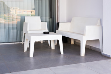 white modern chairs and table outdoors