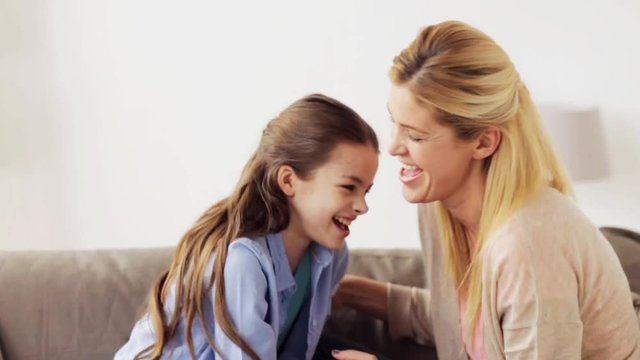 happy family having fun and tickling at home