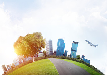Concept of ecology life with skyscrapers and green landscape on round surface